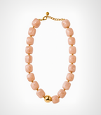 Necklace with pink beads and gold accents on a white background
